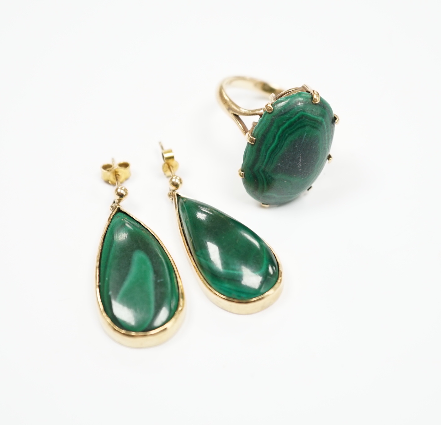 A 9ct and oval cut malachite set dress ring and pair of matching drop earrings, ring size P, gross weight 20.1 grams.